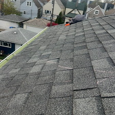 Buckling-Plywood-on-a-Commercial-Shingle-Roof-in-Chicago-Causes-and-Repair-Solutions 1