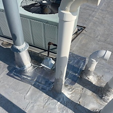Chicago-Commercial-Flat-Roof-Leaking-Around-Protrusions-Get-It-Fixed 1