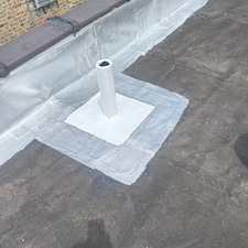 Commercial-Flat-Roof-Leak-Repair-in-Chicago-Fix-Leaks-Around-Roof-Boots 1