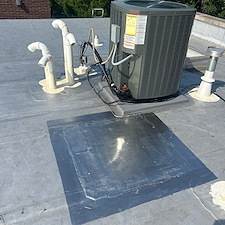 Damaged-Commercial-Flat-Roof-Membrane-Caused-by-Sunken-HVAC-Unit-Causes-Risks-and-Repair-Solutions 0