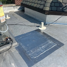 Damaged-Commercial-Flat-Roof-Membrane-Caused-by-Sunken-HVAC-Unit-Causes-Risks-and-Repair-Solutions 1