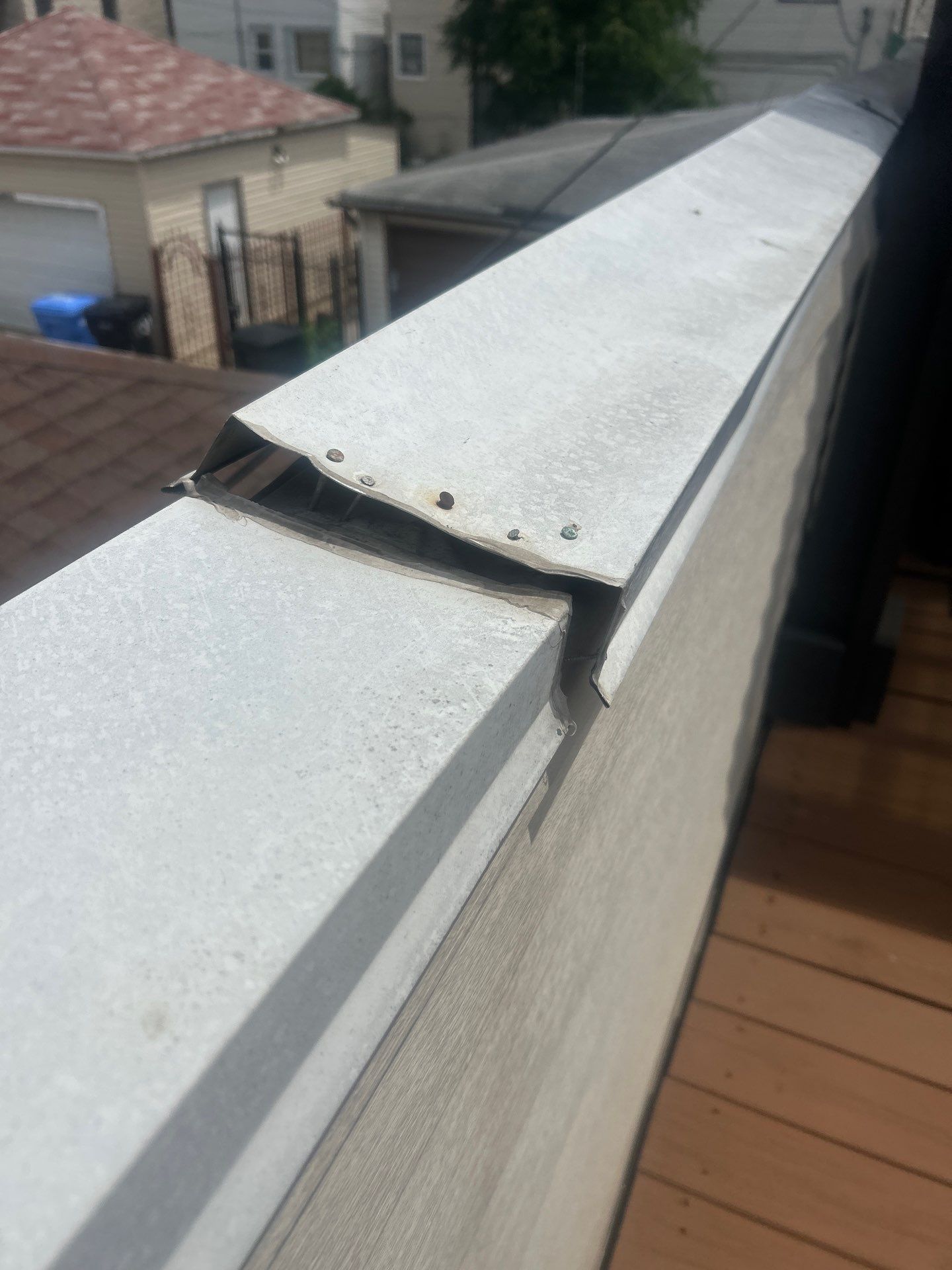 Damaged Metal Coping on Chicago Commercial Flat Roof: Repair or Replace?