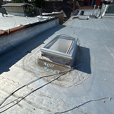 Expert-Cricket-Installation-Alongside-Skylights-on-Chicago-Flat-Roofs 0