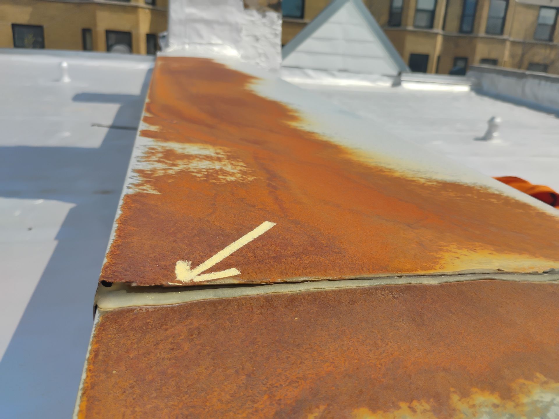 Flat Roof Leaking in Chicago? Gaps in Metal Coping Seams Could Be the Cause