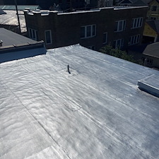Loose-Roof-Membrane-Along-Gutter-Trusted-Commercial-Roof-Repairs-in-Chicago 0
