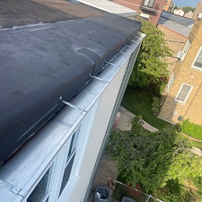 Loose-Roof-Membrane-Along-Gutter-Trusted-Commercial-Roof-Repairs-in-Chicago 1