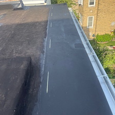 Loose-Roof-Membrane-Along-Gutter-Trusted-Commercial-Roof-Repairs-in-Chicago 2