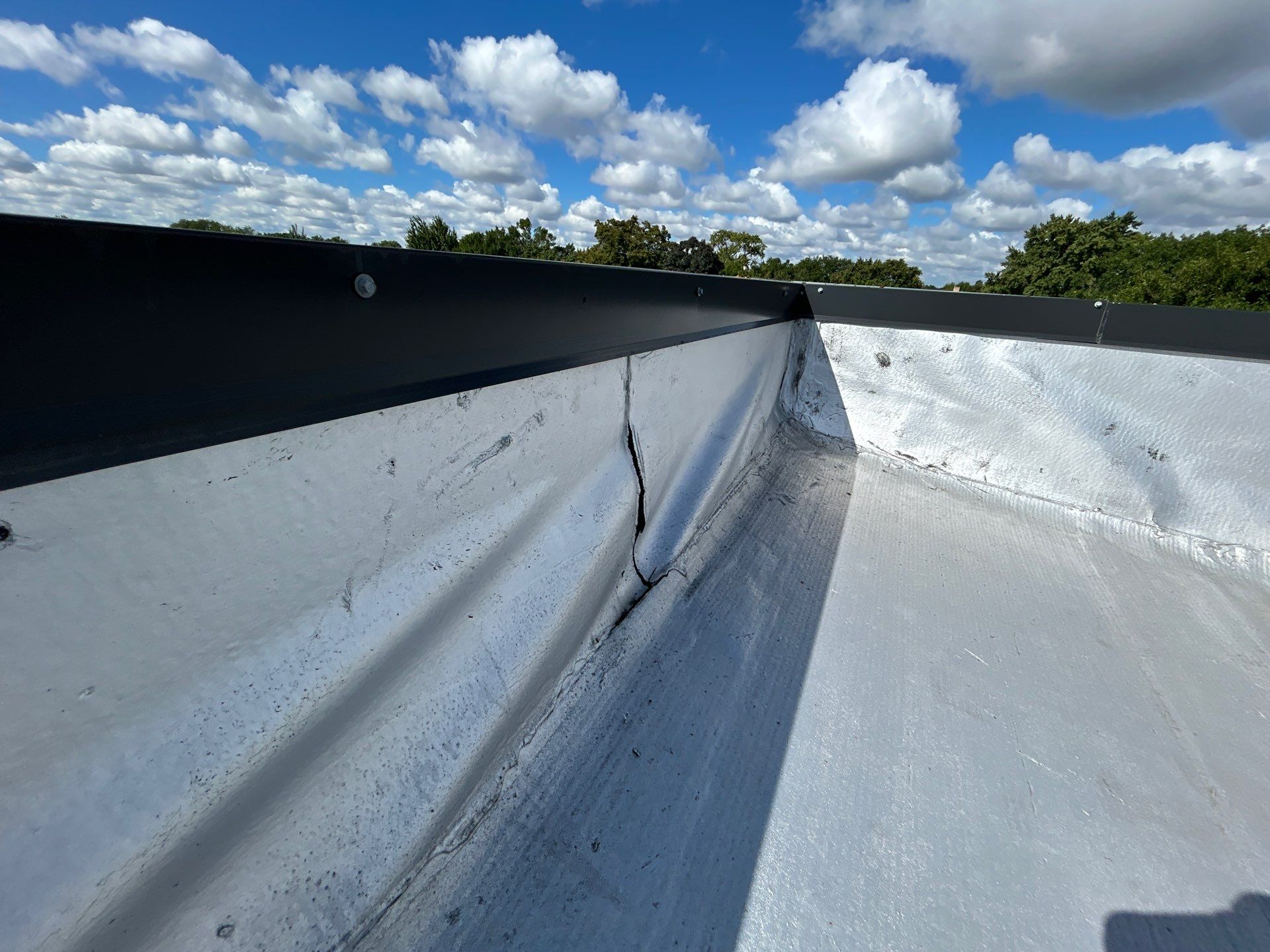Loose Wall Flashing on Chicago Flat Roofs: Roof Repairs by Anchor Point Roofing