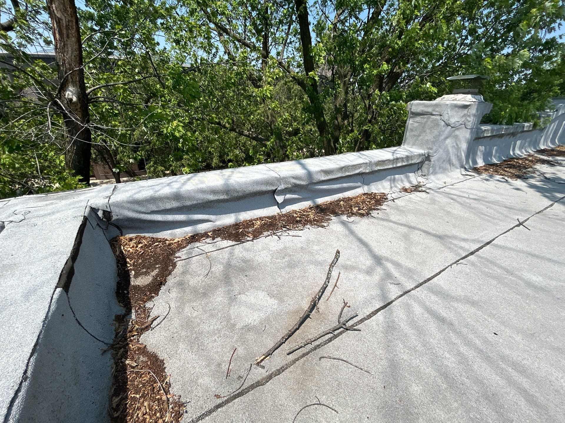 Loose Wall Flashing on Chicago Commercial Flat Roof Causes Water Intrusion: What You Need to Know