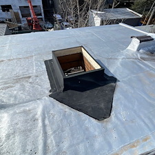 Low-Hatch-Curb-Causing-Water-Intrusion-on-Flat-Roof-in-Skokie-Heres-How-We-Fixed-It 3