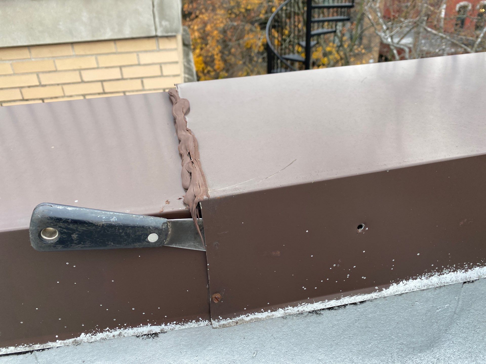 Mount Prospect Flat Roof Leak? Check the Metal Coping Seams First