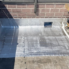 Need-a-New-Scupper-for-Your-Low-Slope-Roof-in-Chicago-Anchor-Point-Roofing-Can-Help 1