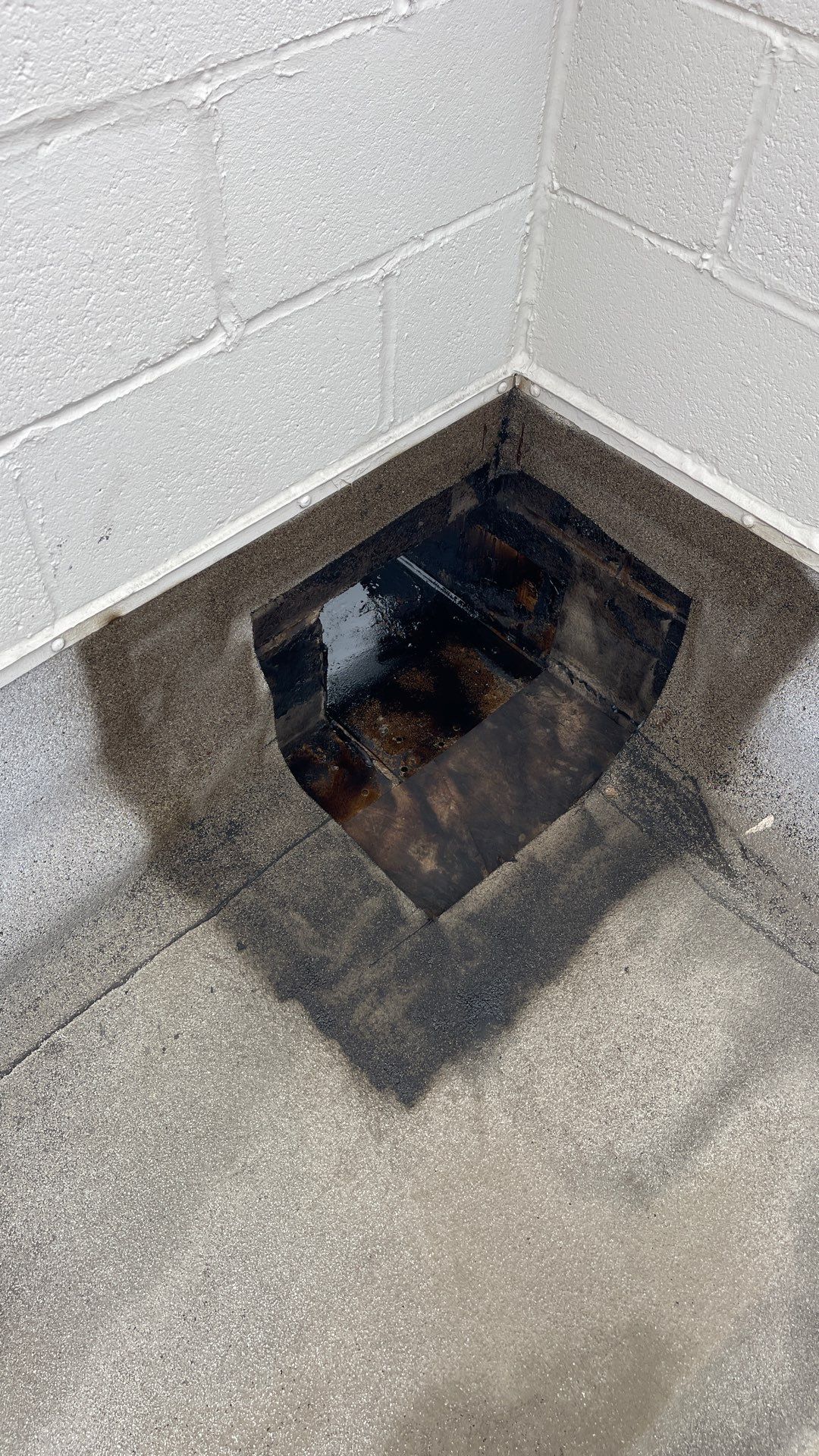 Openings Around Scuppers Leading to Leaks on a Commercial Flat Roof in Chicago