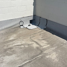 Openings-Around-Scuppers-Leading-to-Leaks-on-a-Commercial-Flat-Roof-in-Chicago 3