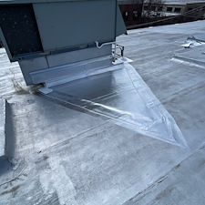 Ponding-Water-on-Park-Ridge-Flat-Roof-Ask-About-Cricket-Installation 4