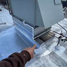 Ponding-Water-on-Park-Ridge-Flat-Roof-Ask-About-Cricket-Installation 2