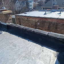What-Causes-a-Flat-Roof-Membrane-to-Come-Loose-and-Leak 1