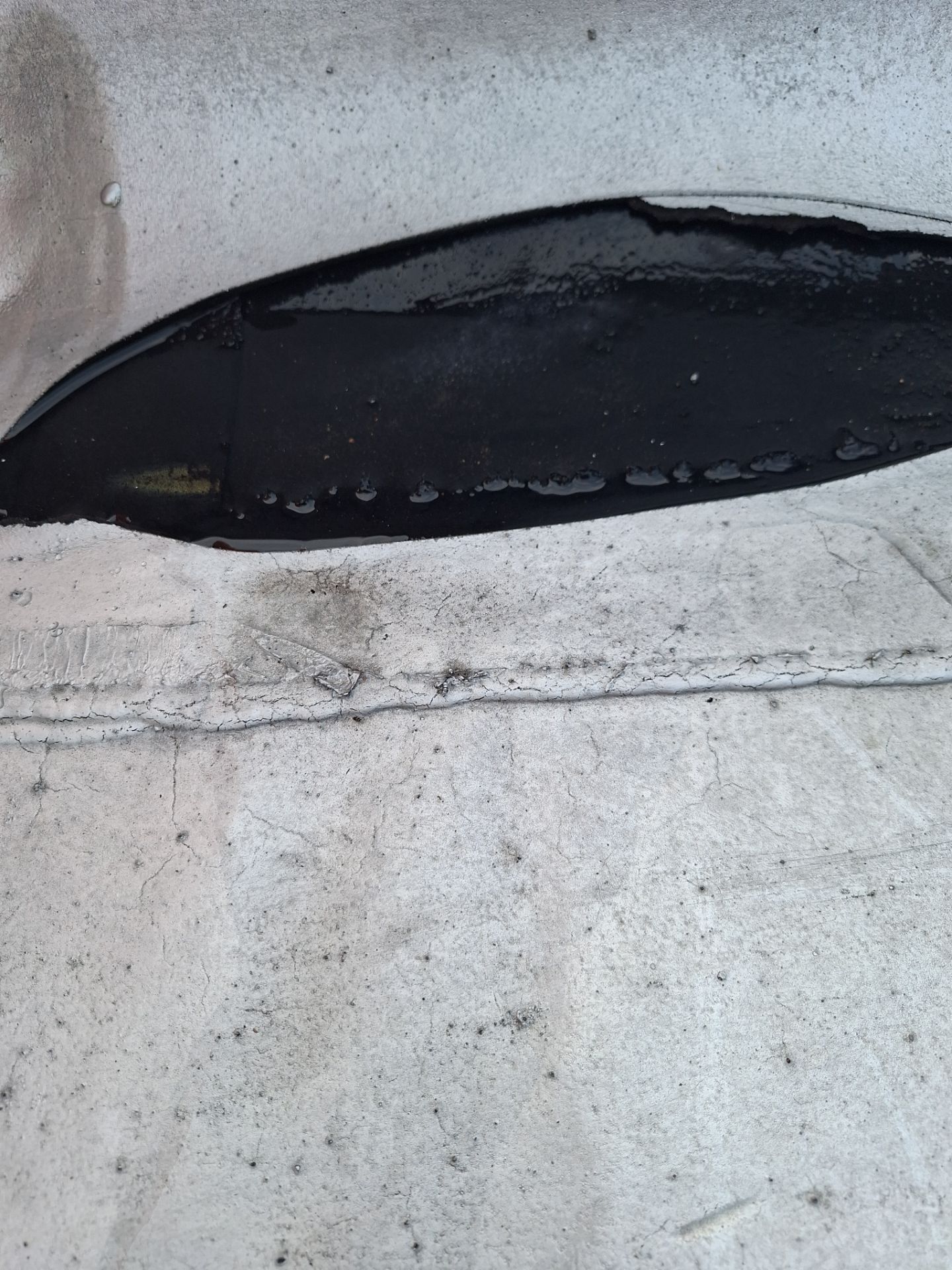 What Happens When Water Gets Trapped Under a Flat Roofing Membrane?