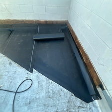 Why-Installing-a-Cricket-on-Your-Commercial-Flat-Roof-in-Chicago-Prevents-Costly-Water-Damage 2