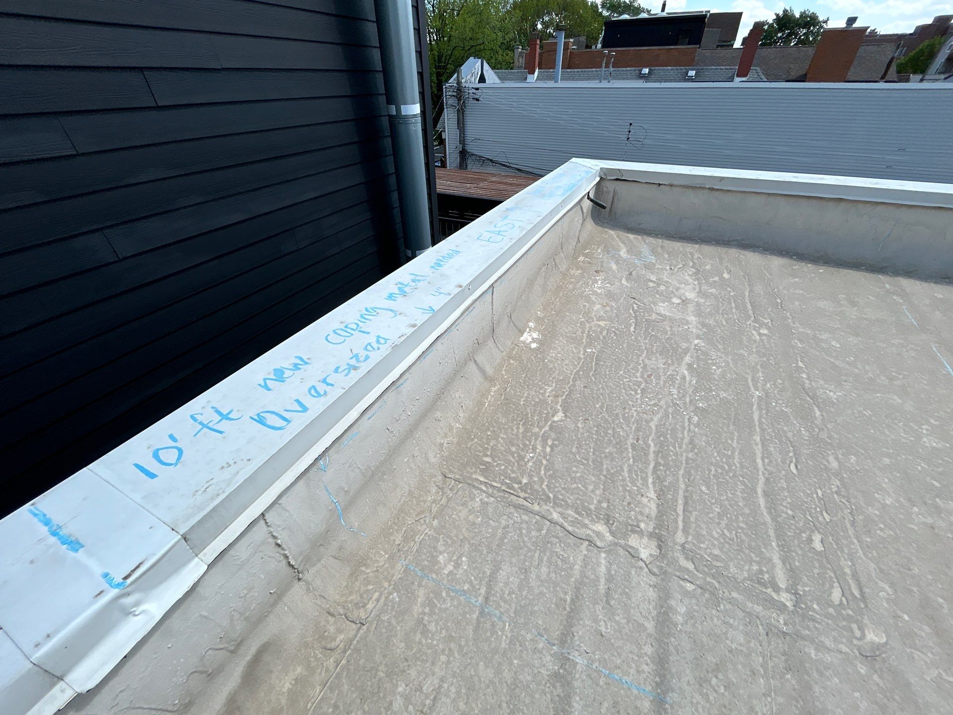 Why is the wall flashing on my flat roof coming loose?