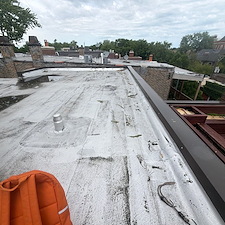 Will-a-Reflective-Coating-on-My-Flat-Roof-Actually-Keep-My-Chicago-Home-Cooler 4